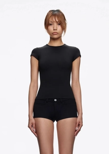 Detail of slim fit black sports t-shirt and shorts set on model with clean white background