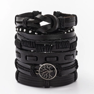 Detailed close-up of multi-layer leather bracelets featuring silver tree of life and studs