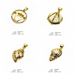 Detail of four copper zircon charms including crown ring, shell, and conch shapes