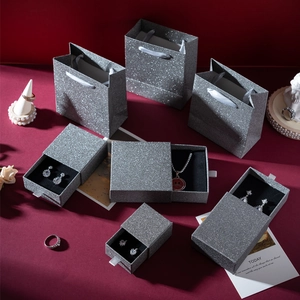Silver glitter drawer jewelry box set with matching gift bags on red background