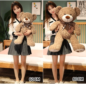Size comparison between 60cm and 80cm brown teddy bears with checkered neck bows
