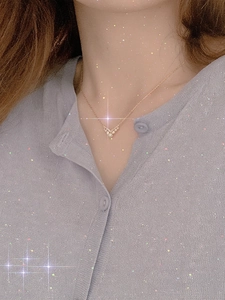 Elegant 14K gold plated S925 silver V-shaped necklace with pearls worn on neckline