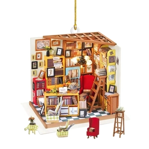 3D bookstore bookshelf hanging ornament with red chair and miniature books on white back