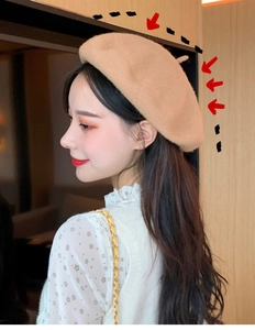 Detailed side view of beige wool beret showing its structured and flattering fit