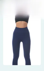 Detailed view of seamless high-waisted navy yoga leggings with tummy control feature