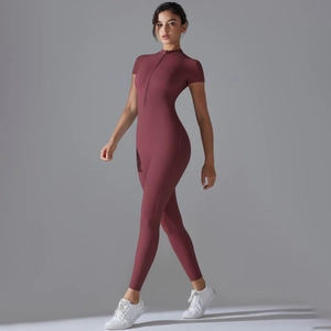 Detail of burgundy high-stretch yoga jumpsuit with standing collar and front zipper