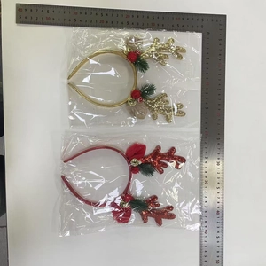 Detailed view of glitter reindeer antler headbands with bells and size measurement