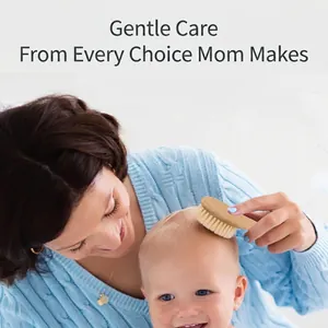Beechwood baby hair brush set being used by a mother for newborn scalp massage and care