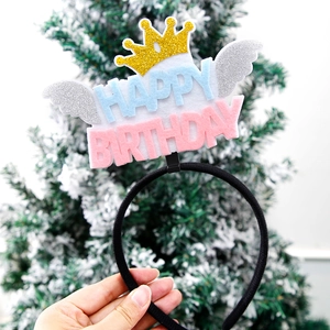 Detail of glitter birthday crown headband with wings and Happy Birthday felt letters