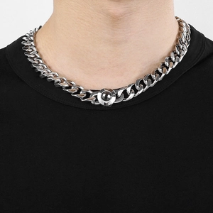 Polished silver Cuban link chain necklace for men featuring a unique circular buckle