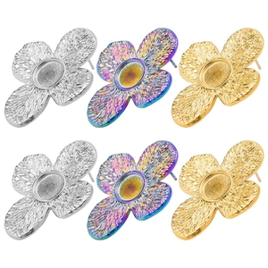 Detailed view of flower-shaped 304 stainless steel earring bases in silver, gold and rainbow