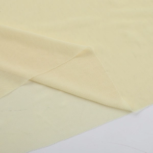 Macro shot of cream mesh fabric texture with elegant diagonal folds for formal dress