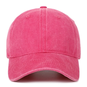 Detailed texture of rose red vintage washed cotton baseball cap with ventilation eyelets