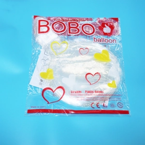 Close-up of clear stretchy plastic Bobo balloon packaging with heart patterns and CE logo