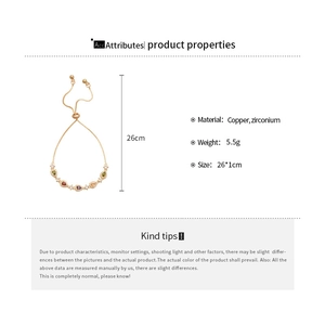 Detail of adjustable copper bracelet featuring colorful teardrop and round zircon stones