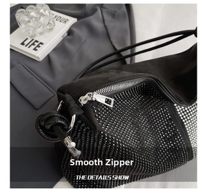 Close-up of smooth silver metal zipper on a premium black rhinestone tote bag