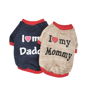 Detail of two-pack dog sweaters in navy and beige with heart prints and red ribbed edges