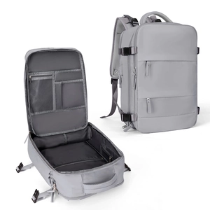 Detailed view of grey travel backpack main compartment with multiple storage pockets