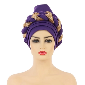Detail of purple turban hat featuring shimmering golden sequin braided decorative band