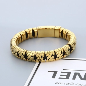 Detail of gold interlocking chain links bracelet with a smooth polished surface and clasp