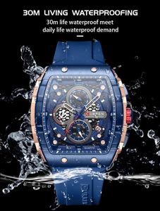 Close-up of waterproof dark blue quartz watch with water splashes on dark background
