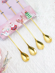 Set of 4 golden Christmas dessert spoons with enamel snowman and reindeer ornaments