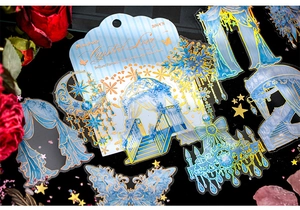 Macro shot of PET stickers featuring blue starry sky scenery and golden laser outlines