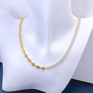 Golden coffee bean chain necklace with rectangular zircon crystals on a white mannequin
