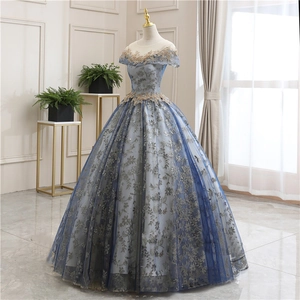 Elegant navy evening gown with gold embroidery and sparkling sequined tulle skirt