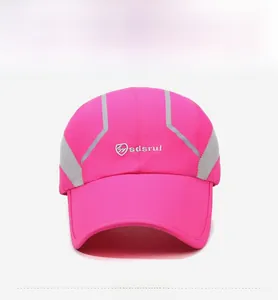 Detail of rose red quick-dry sports cap with grey breathable mesh and reflective lines