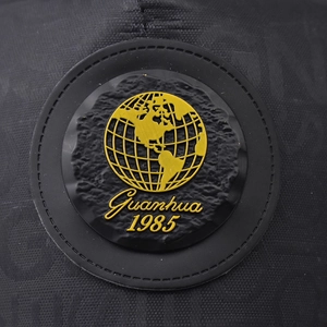 Retro baseball cap featuring a black matte 1985 Guanhua globe logo patch detail