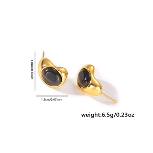Detail view of irregular gold earrings with black gemstones and size dimensions