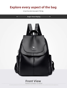 Front view of black leather anti-theft backpack featuring golden kangaroo logo detail