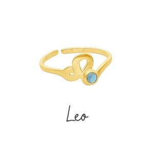 Macro shot of gold Leo zodiac ring with blue zircon stone and S925 engraving detail