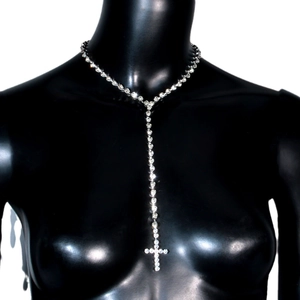 Sparkling silver cross pendant necklace with rhinestones on a black model