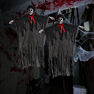 Detail of Halloween hanging ghosts with plastic skulls and torn black fabric decor