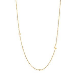 Close-up of gold S925 silver necklace featuring a letter L pendant and small diamonds