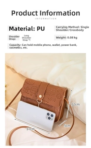 Detail view of brown PU leather crossbody bag with embossed patterns and phone capacity