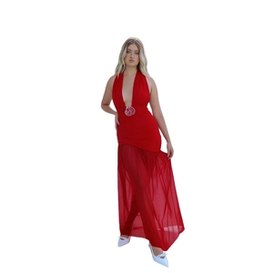 Detail view of the red halter evening gown featuring a rose waist decor and tulle skirt