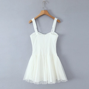 White mini slip dress featuring sleek bodice and mesh polka dot ruffled skirt for women