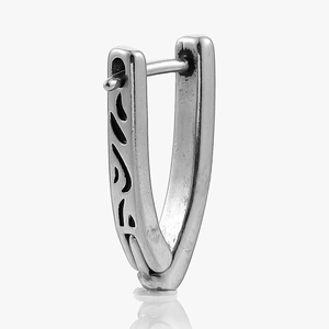 Detailed side view of vintage stainless steel ear cuff with engraved flame pattern