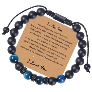 Detail of beaded bracelet with matte black stones and card message for son