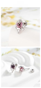 Detailed view of conch stud earrings with pink zirconia bead and starfish detail