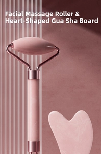 Detailed view of pink quartz face roller and heart-shaped gua sha tool on a textured backdrop