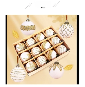 Macro view of white and gold Christmas ball ornaments with intricate glitter patterns