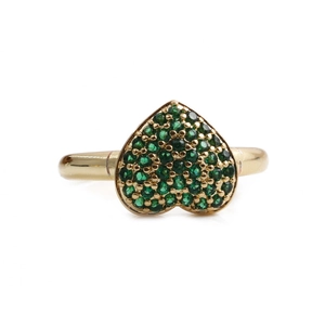 Close-up of gold heart ring with pavé-set green gemstones and detailed micro-inlay