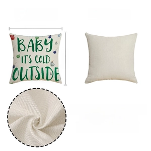 Detail of linen-textured Christmas pillowcase with green print and fabric texture zoom