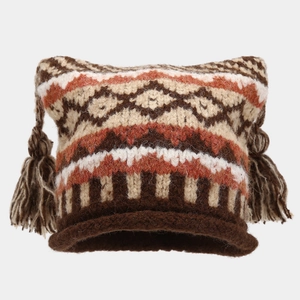 Close-up of Fair Isle knit hat with cat ears, geometric patterns and tassel details