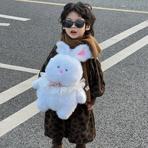 Cute white plush bunny backpack for kids featuring lace bow detail and soft fluffy texture