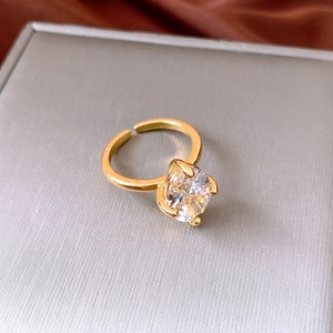 Close-up of elegant gold-plated oval zircon open ring with sparkling detail